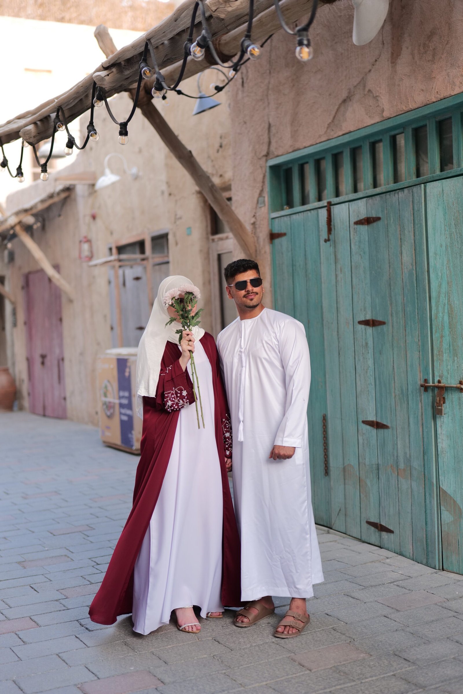 Malikaah maroon abaya with diamond sleeve and white emirati thobe