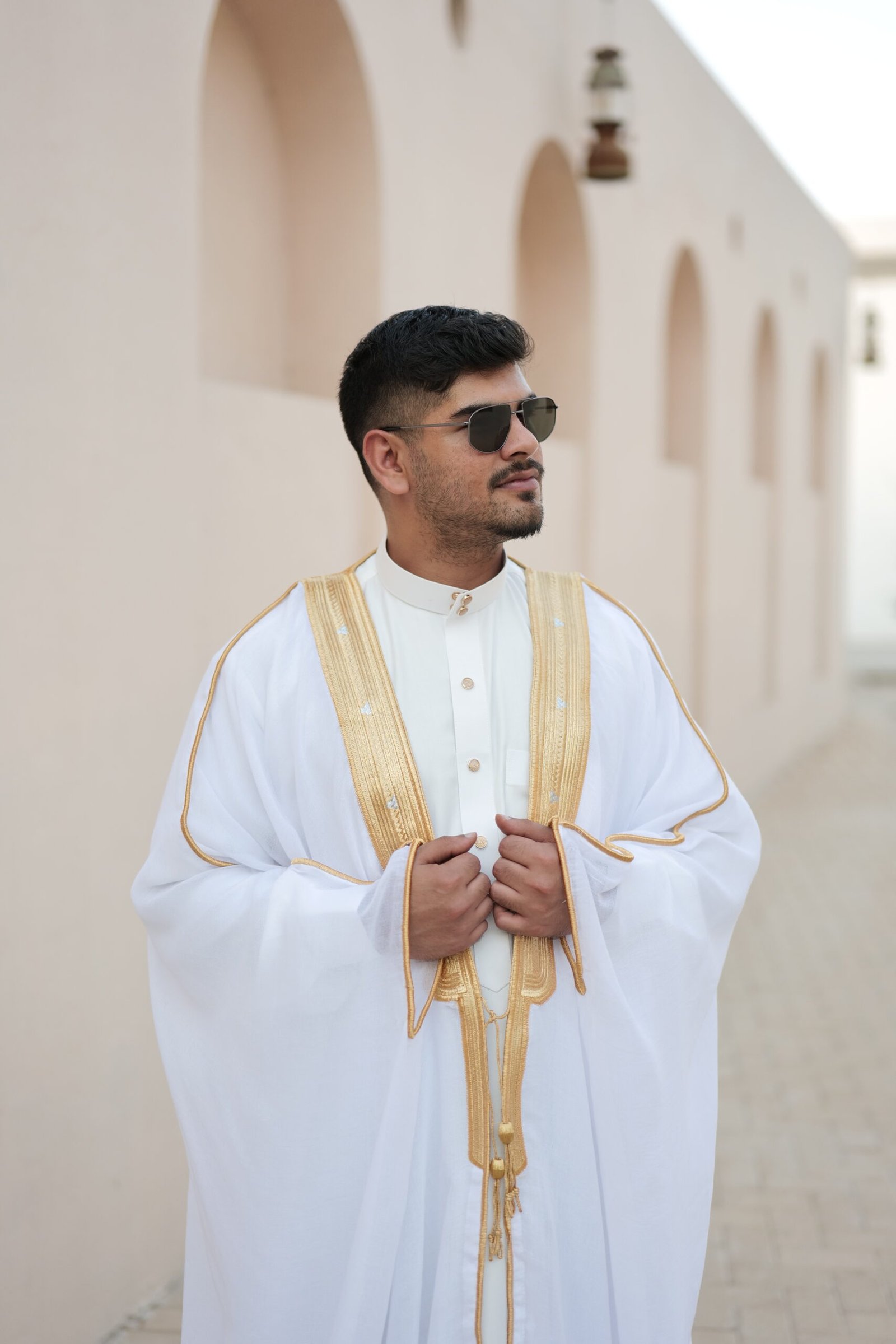 Bisht white and gold half view